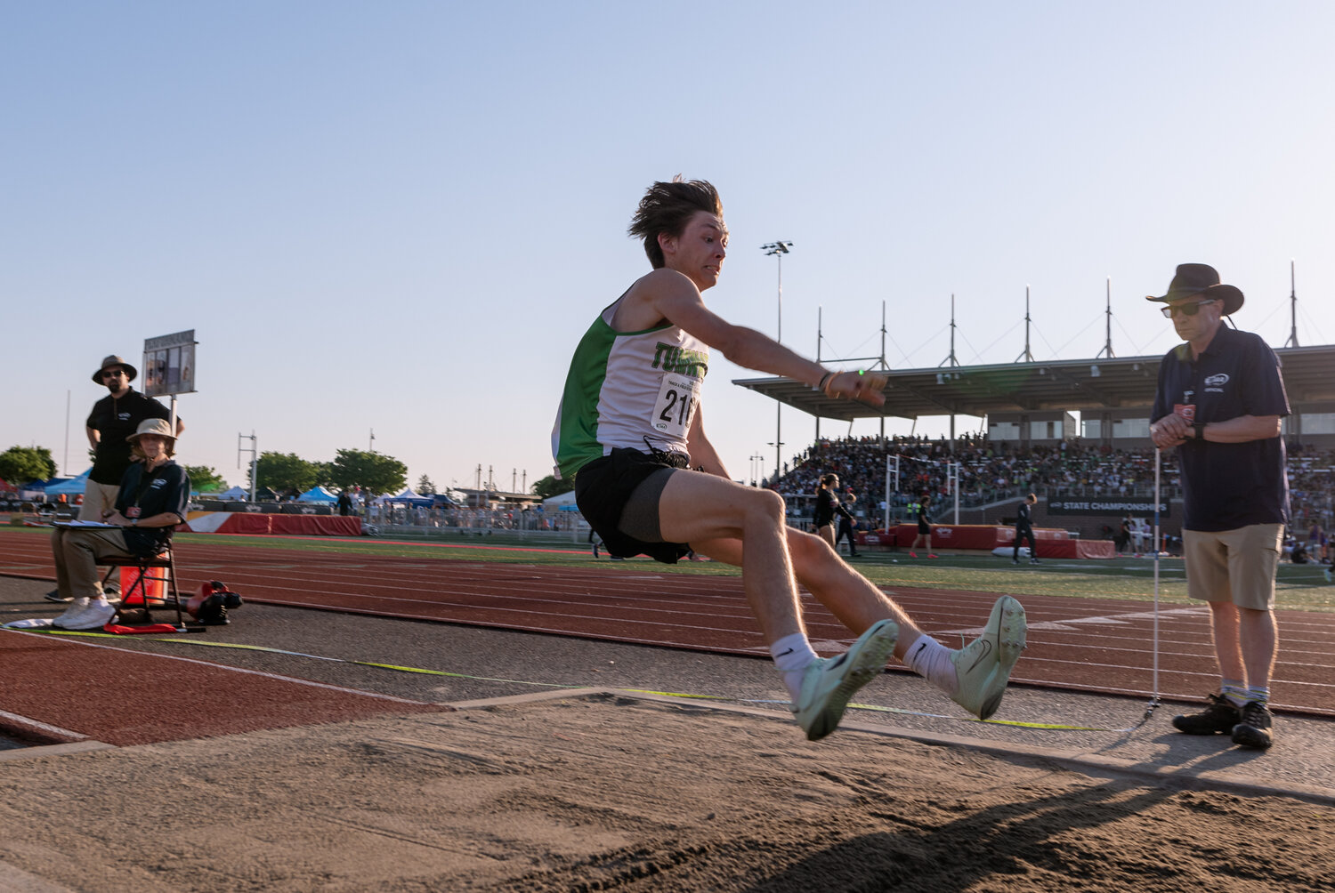 Tumwater’s Aaron Paul braces for landing during the finals of the boys long jump at the WIAA 2A/3A/4A State Track and Field Championships on Thursday, May 25, 2023, at Mount Tahoma High School in Tacoma. (Joshua Hart/For The Chronicle)